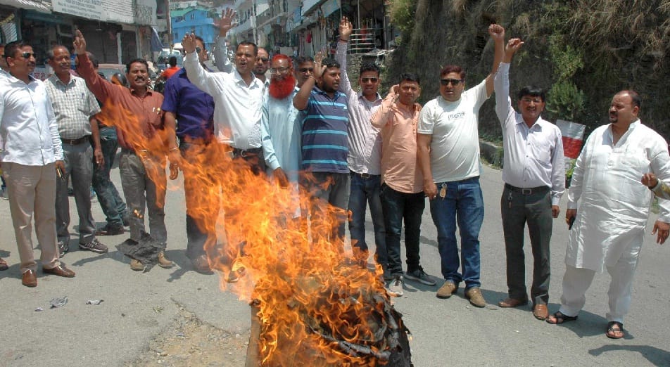 Congressmen blow the effigy of Modi government