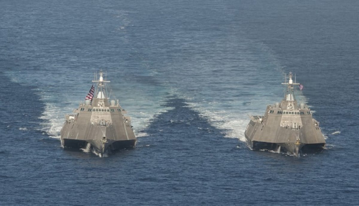 American warship passed through disputed island, China flares