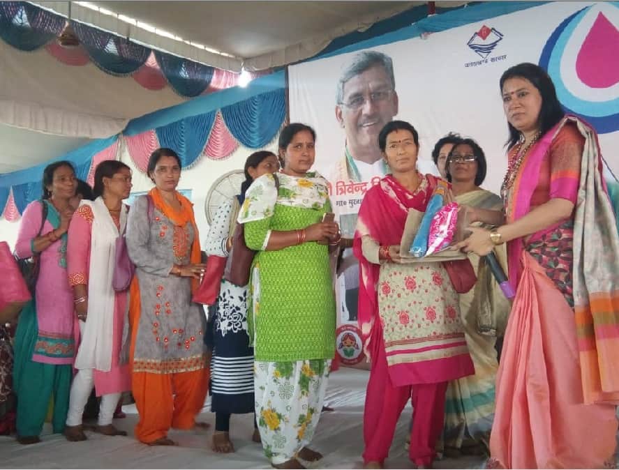 women shouting during Sanitary napkin distribution on World Menstrual Hygiene Day 2018