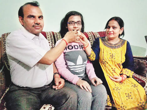District Topper achieves 96.6% marks