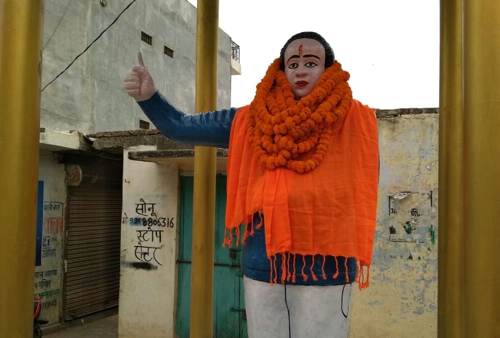 BJP MLA put on saffron clothes on ambedkar statue.