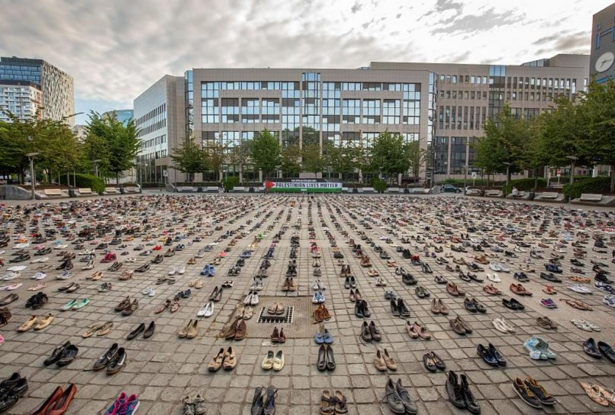 Across four thousand pairs of shoes displayed near EU building over Palestinian deaths
