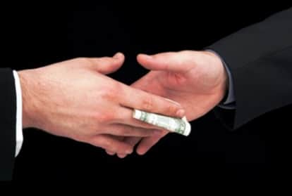 Singapore has charged two Chinese migrant workers for demanding one dollar bribes