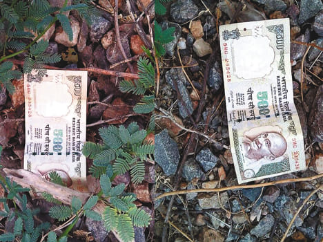 Thousands of old notes thrown by train