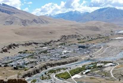 Chinese businessman on land cruiser and Indian businessman on Mule