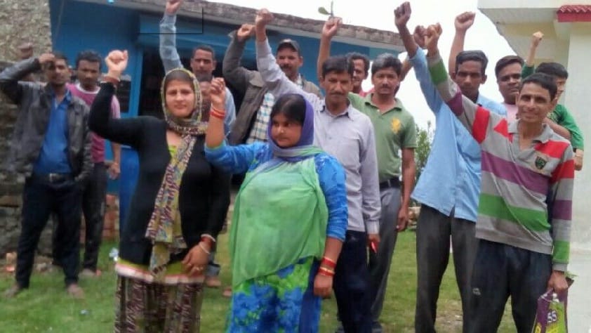 People on the road on the over rating in Talla Baparu