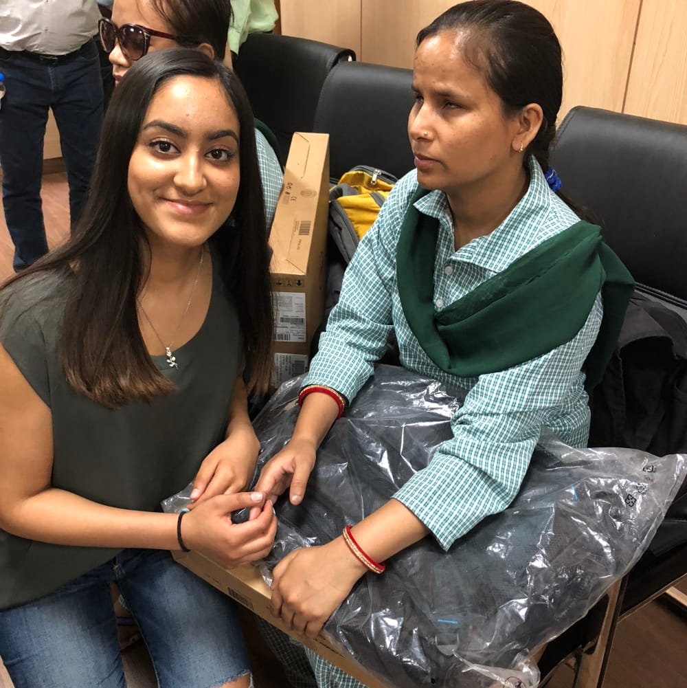 girl buy laptop from pocket money and give it to needy students