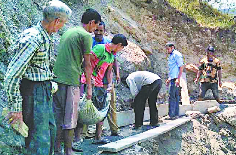 People engaged in repair of canal
