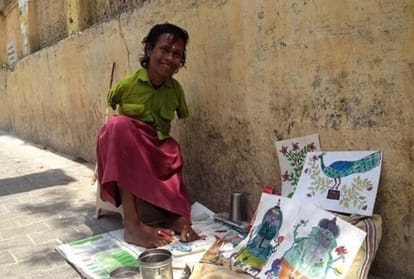 Girl who have no hands make painting by feet inspirational story