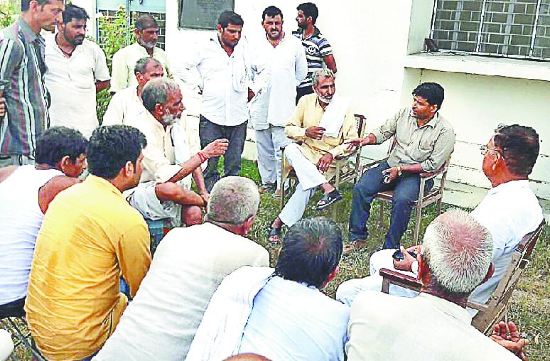 Villagers lock the powerhouse