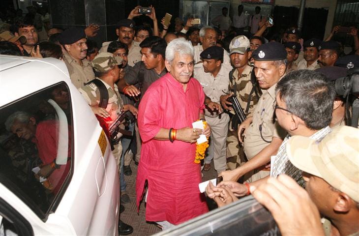 Manoj Sinha, who is survived by the crowd of supporters