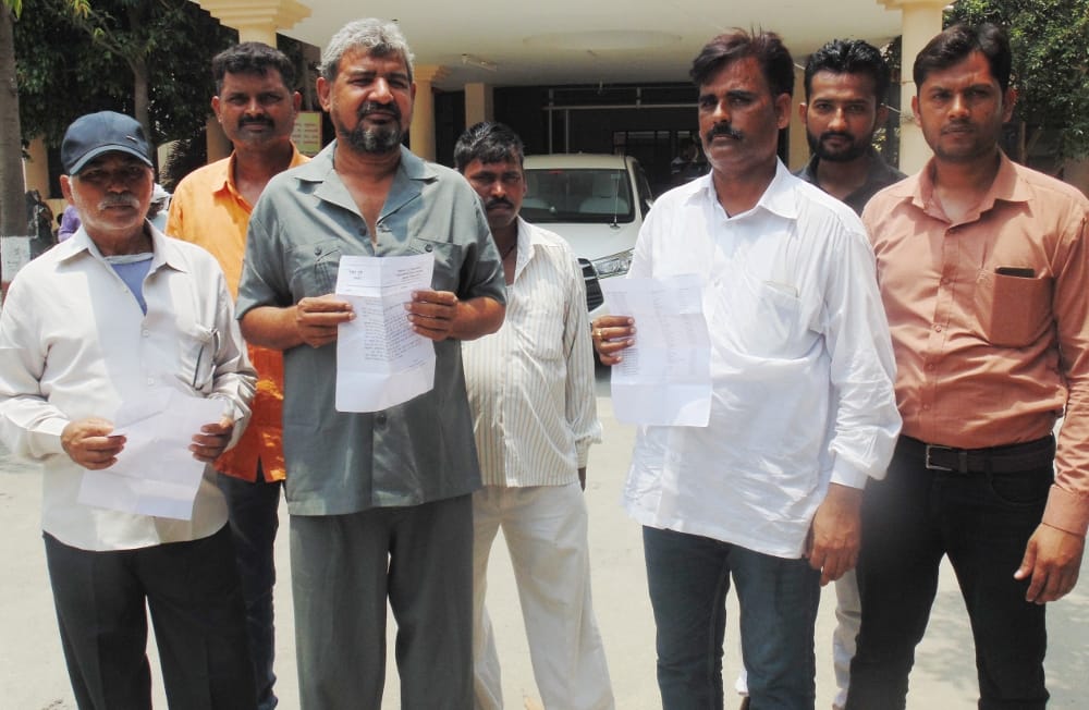 Accused of constructing tender road without