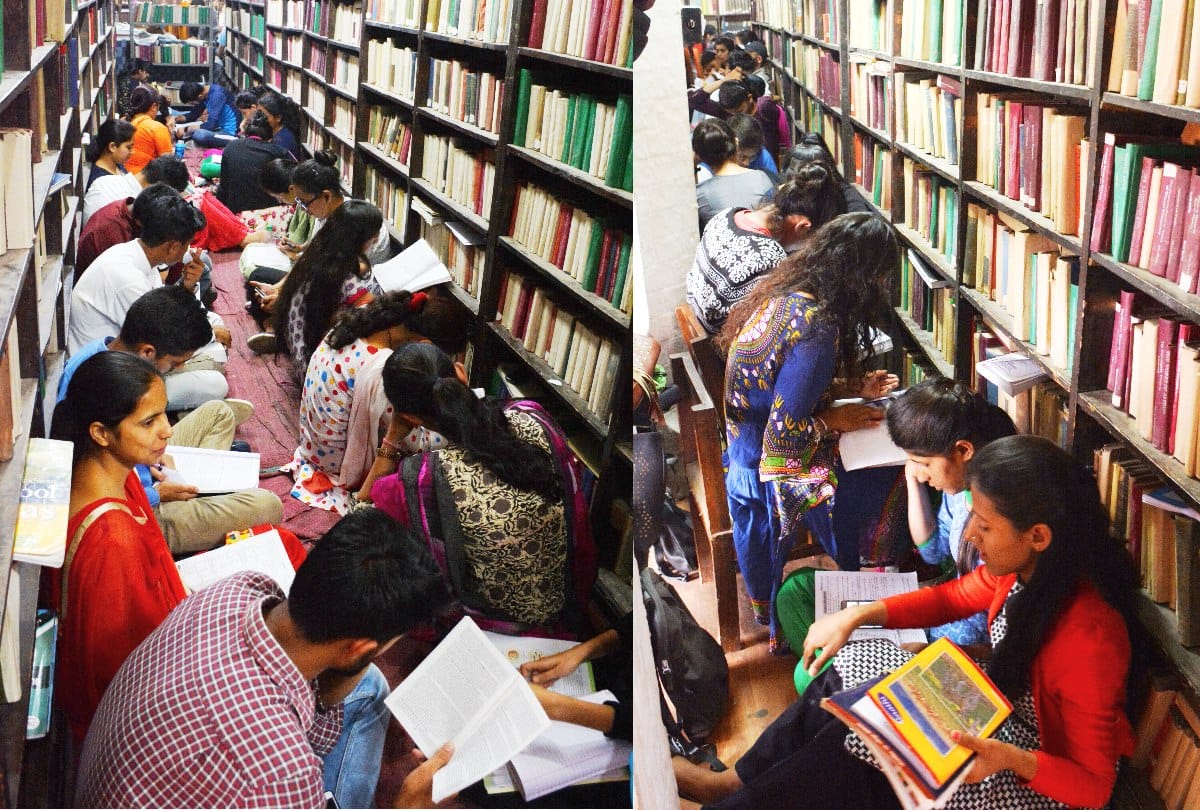 लाइब्रेरी में फर्श पर बैठकर छात्र कर रहे प्रशासनिक सेवा परीक्षा की पढ़ाई