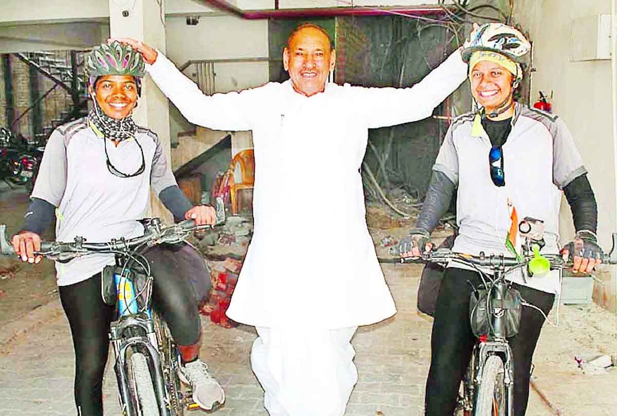 Two girls on a bicycle trip to give message to stop women violence