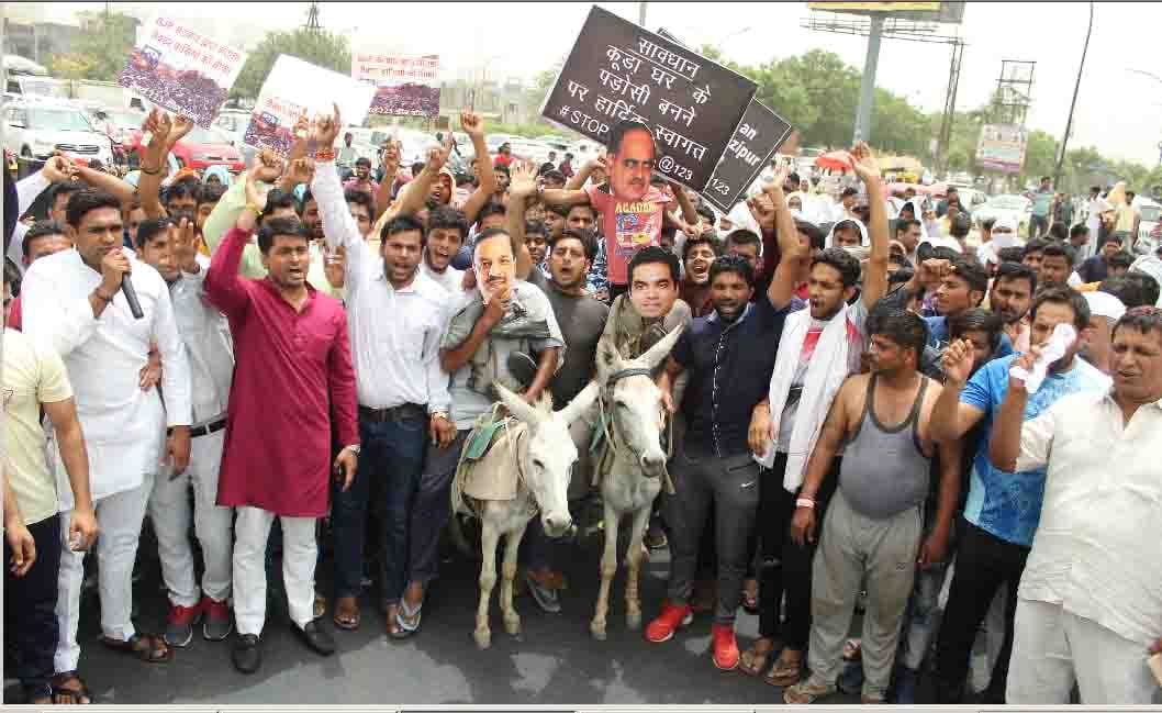  Protest against Dumping Ground by  riding  of the donkey by wearing mask of minister and CEO 