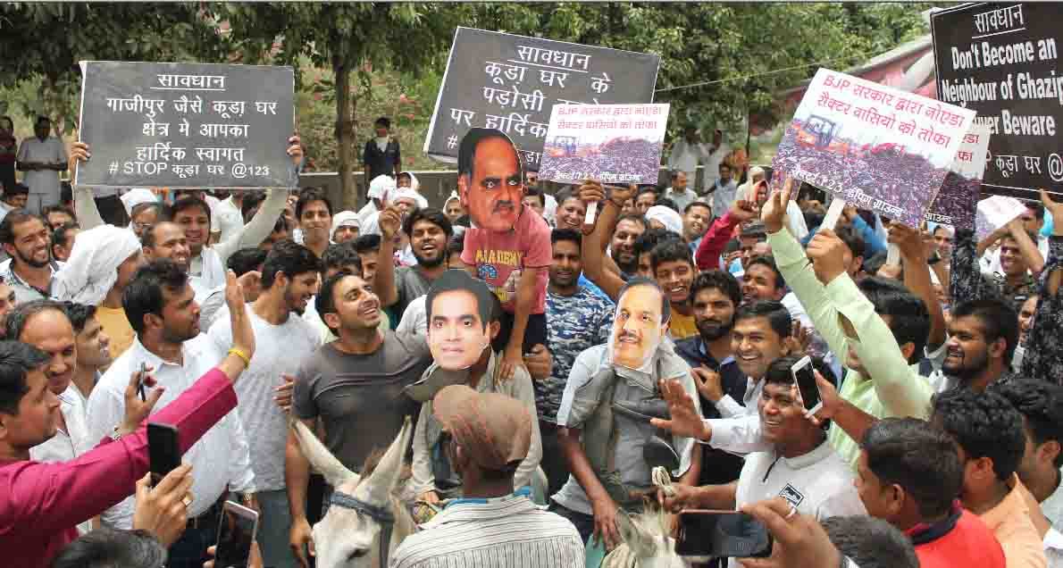  Protest against Dumping Ground by  riding  of the donkey by wearing mask of minister and CEO 