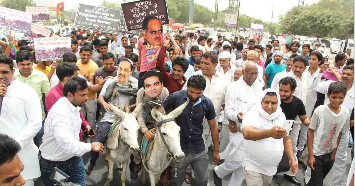  Protest against Dumping Ground by  riding  of the donkey by wearing mask of minister and CEO 