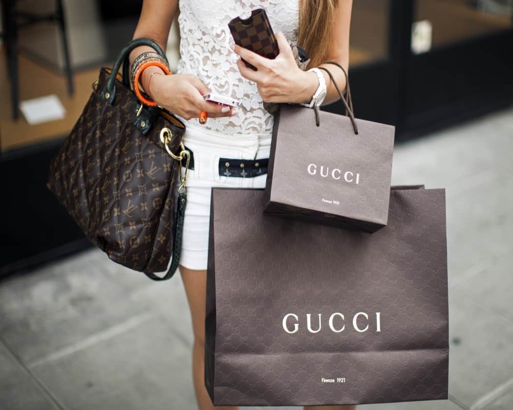 gucci brand launch orange checkered dress for men attached with ribbon bow in waist