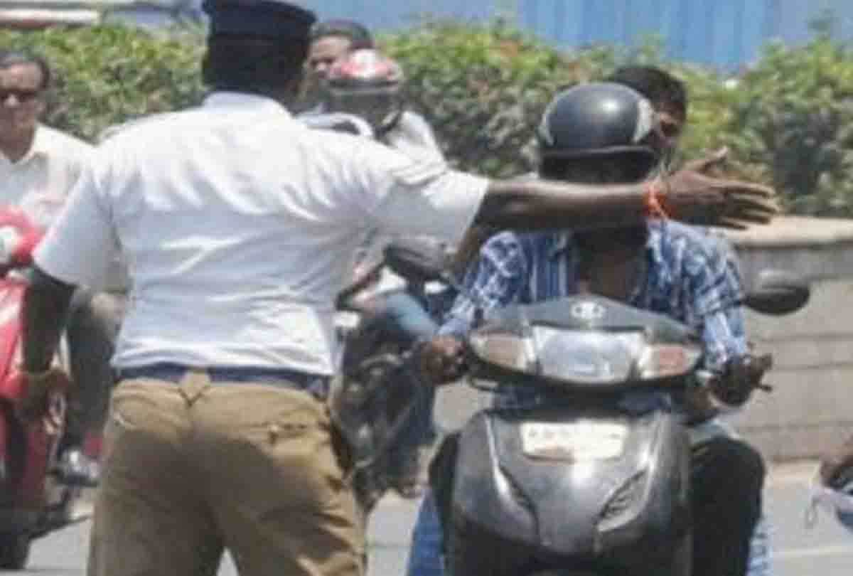 Gujarat man sticks Driving License and RC on Helmet To Avoid Getting Challaned