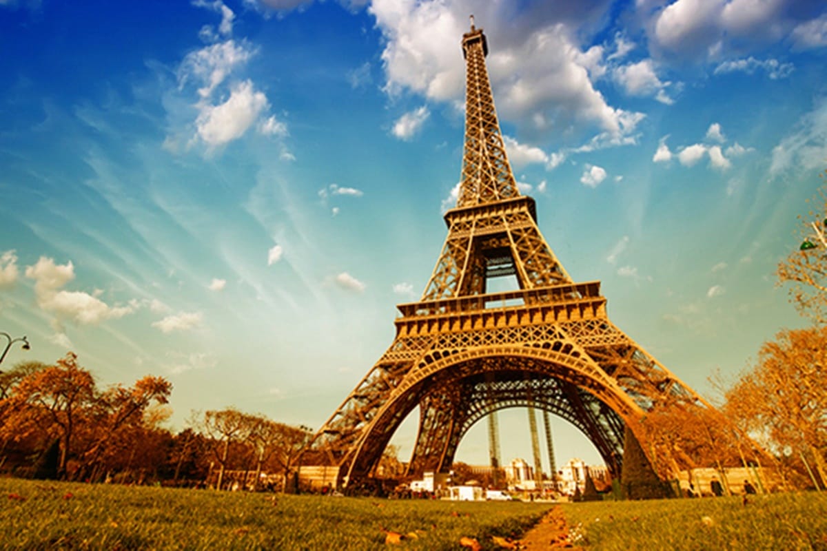 The Eiffel Tower is a iron lattice tower on in Paris