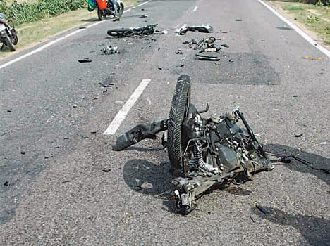 Two people were aboard a bike by collision with uncontrollable truck