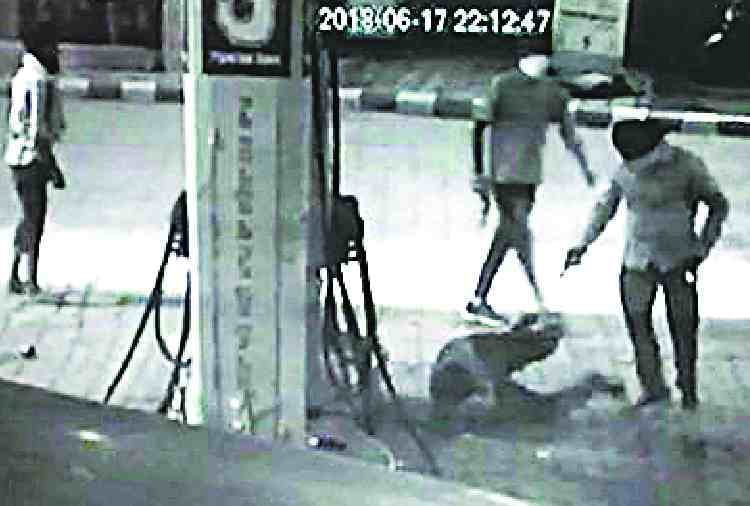 firing on petrol pump, two drivers killed