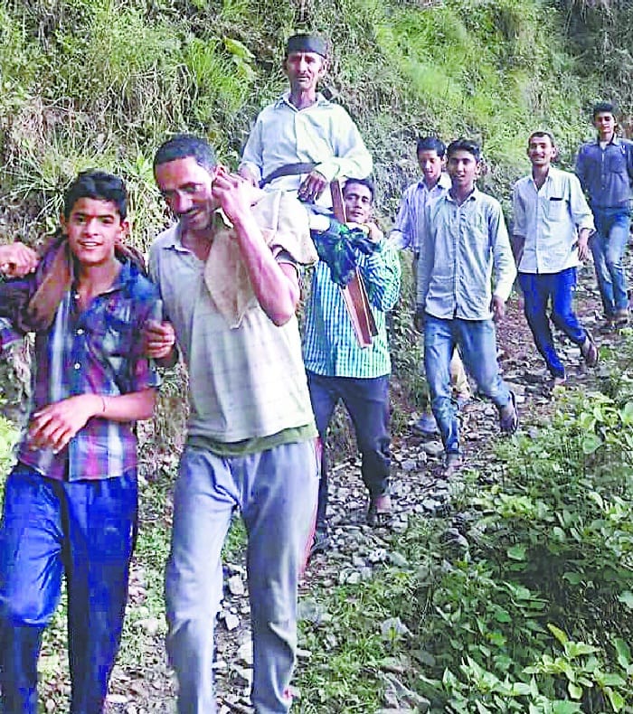 Man Braught to the road in Doli 