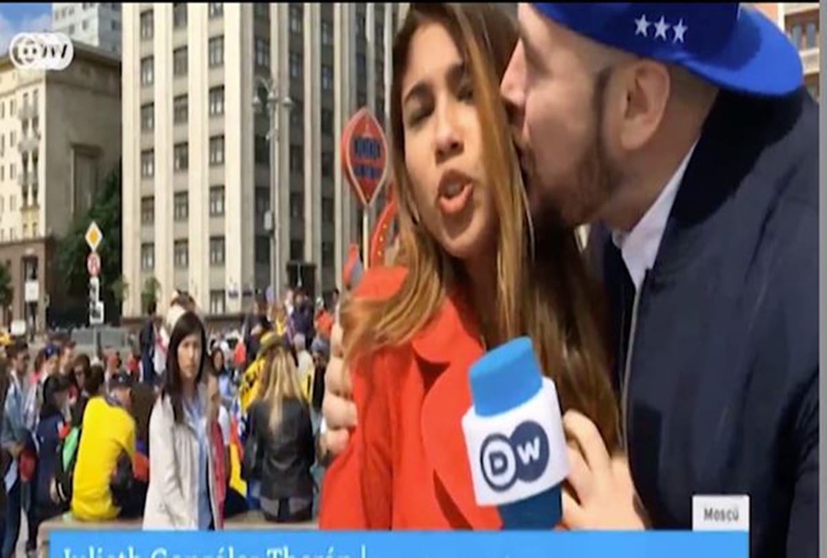 Over Excited fan kissed tv reporter when she was live on tv during FIFA World cup 2018
