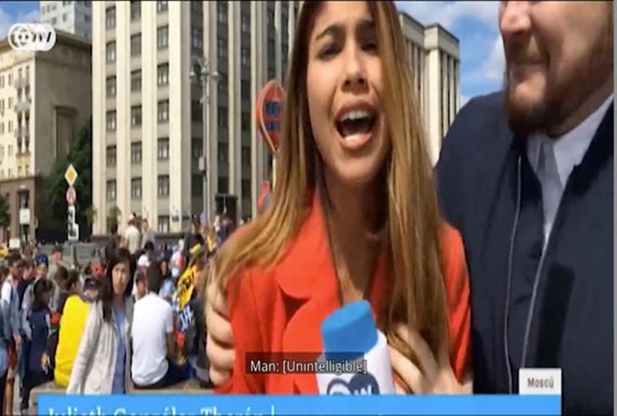 Over Excited fan kissed tv reporter when she was live on tv during FIFA World cup 2018