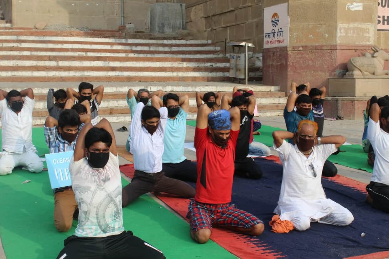International yoga day people do yoga in mask due to air pollution