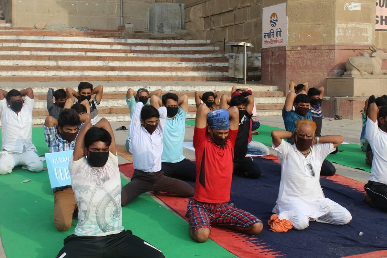 International yoga day people do yoga in mask due to air pollution