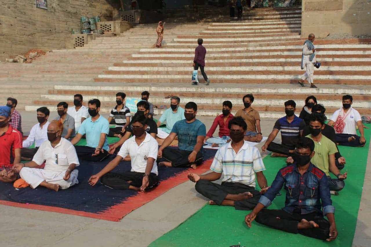 International yoga day people do yoga in mask due to air pollution