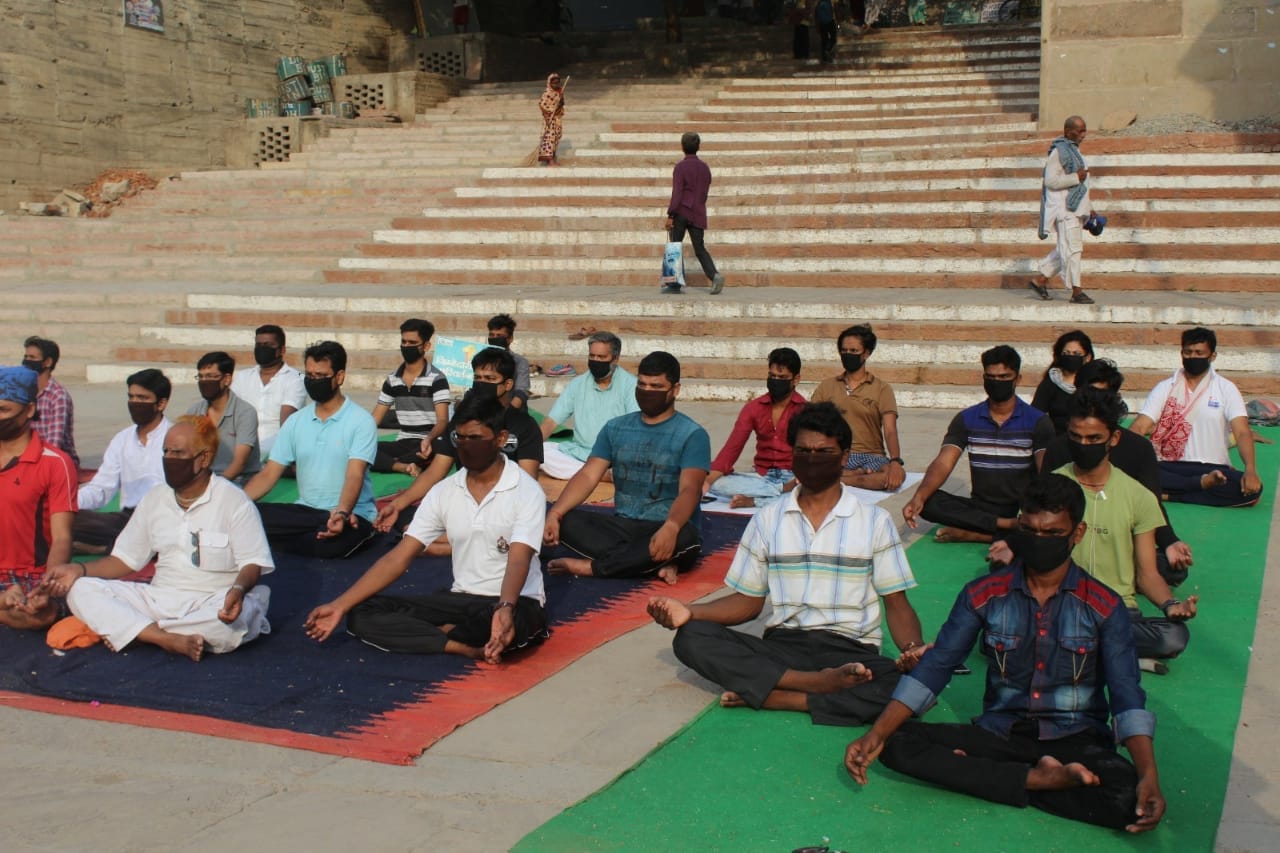 International yoga day people do yoga in mask due to air pollution