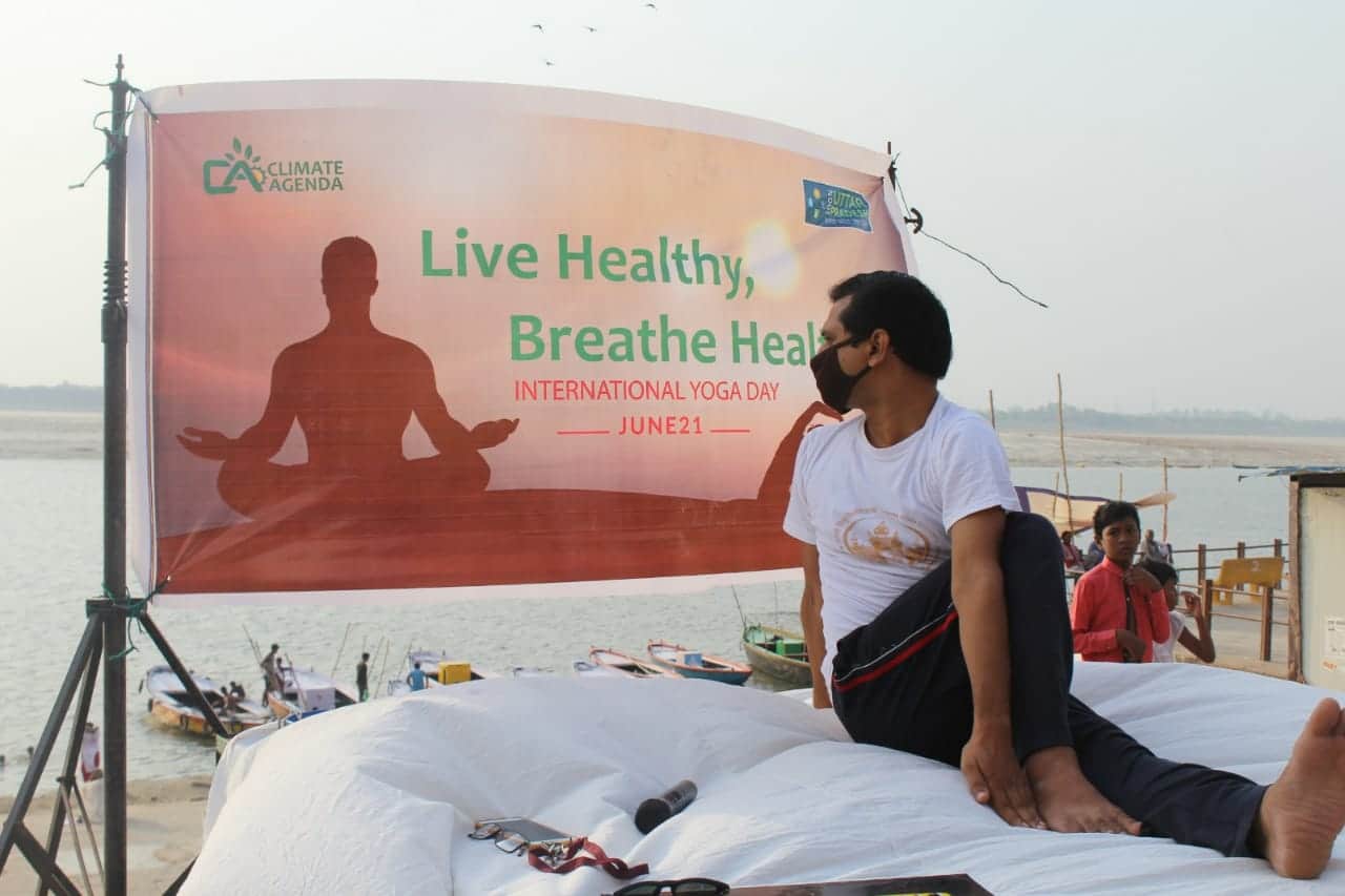 International yoga day people do yoga in mask due to air pollution