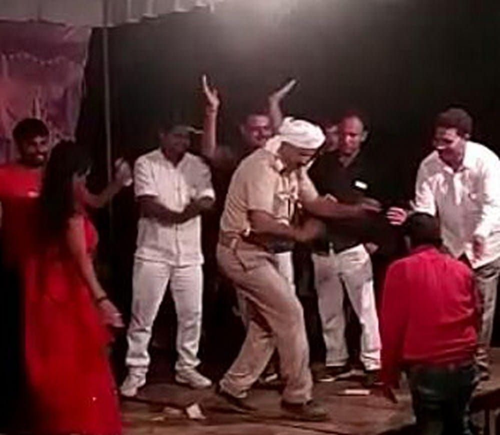 a police man danced in uniform, suspend 