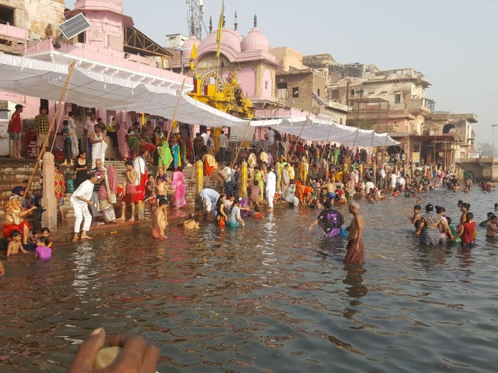 the devotees perform bath at ganga dussehra festival