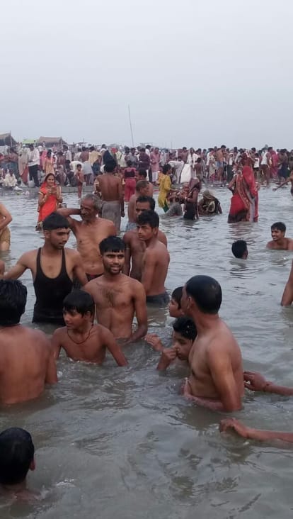 the devotees perform bath at ganga dussehra festival