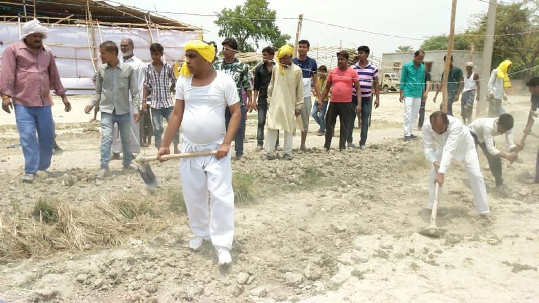 om prakash rajbhar come out for road construction with spade in his village
