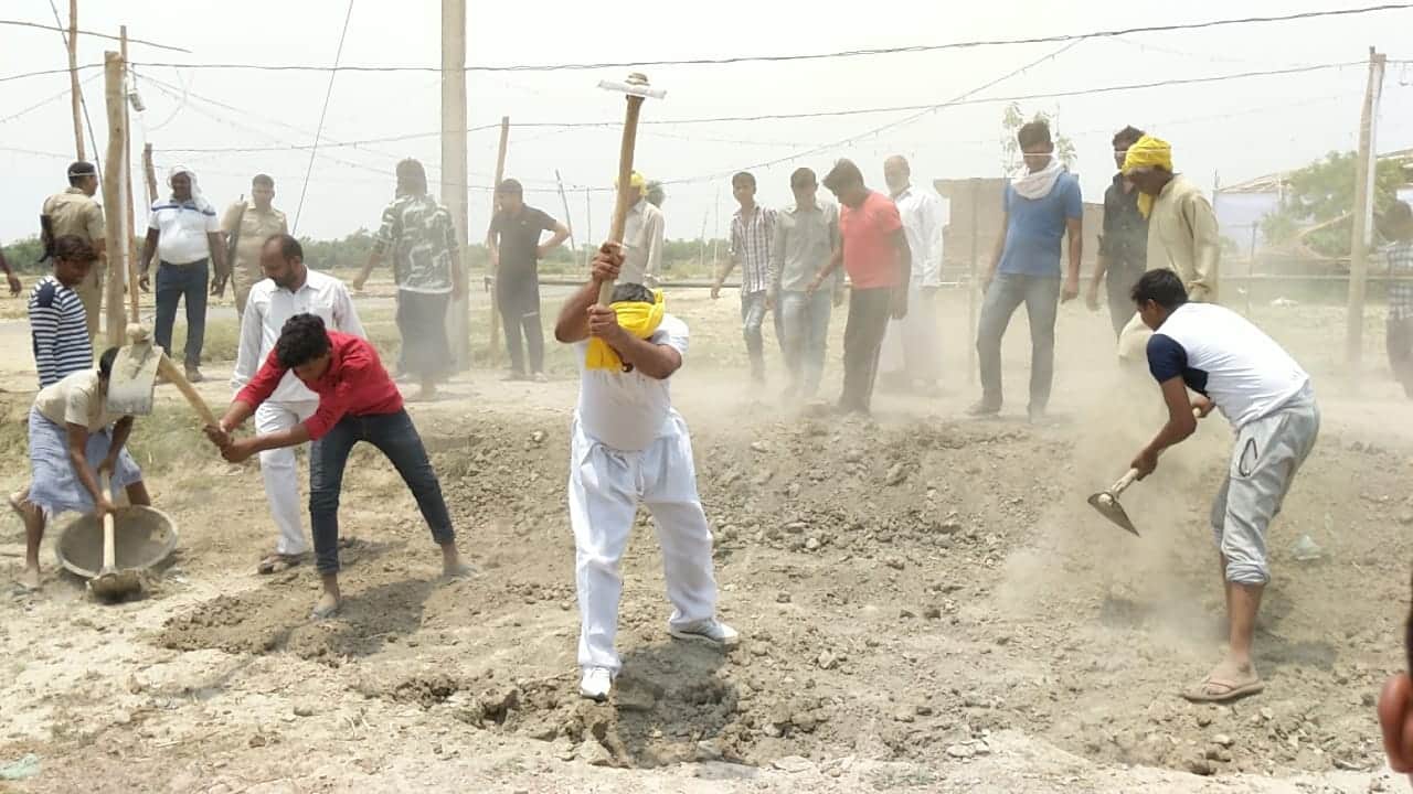 om prakash rajbhar come out for road construction with spade in his village