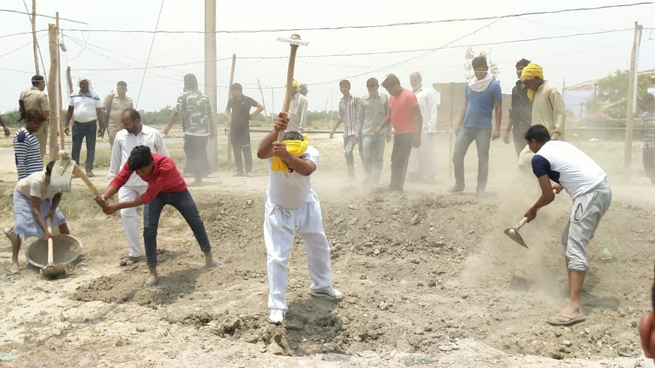 om prakash rajbhar come out for road construction with spade in his village