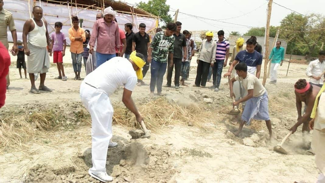 om prakash rajbhar come out for road construction with spade in his village
