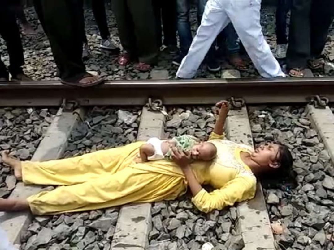 woman lying on railway track with her child is safe after train passed in MP  
