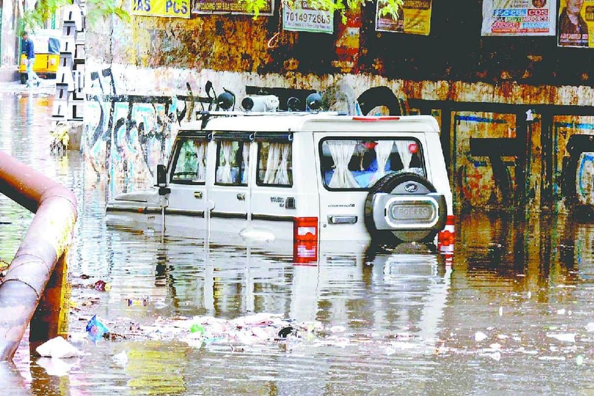 what to do if car stuck in water car care tips for monsoon car stuck in rain water car care tips for rainy season monsoon water logging in delhi water logging in gurgaon