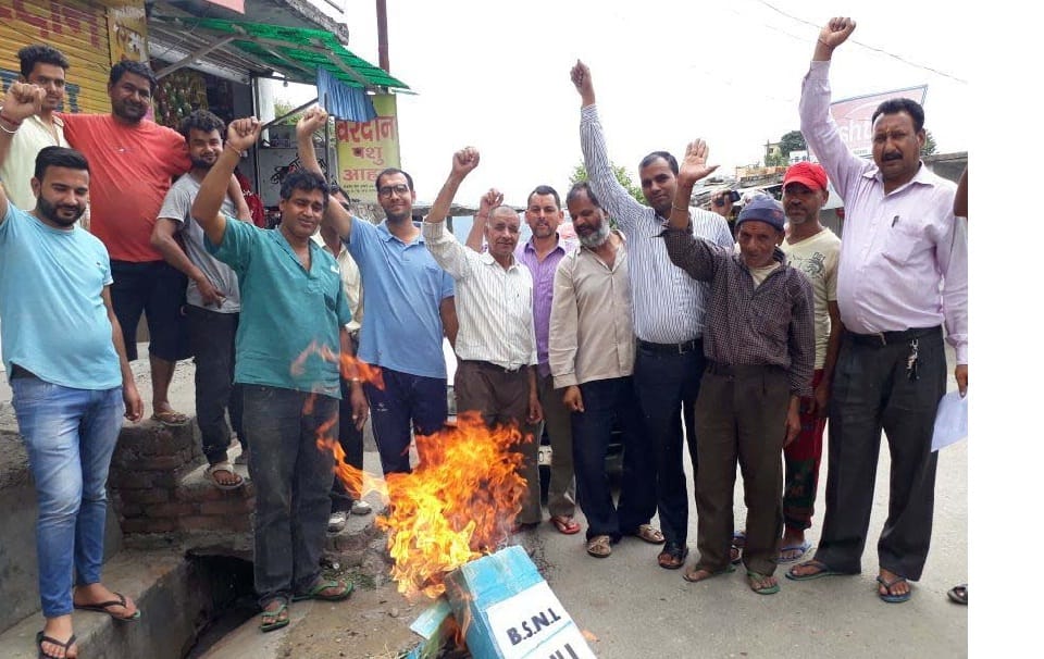 People angered by stalled communications service, blew effigy