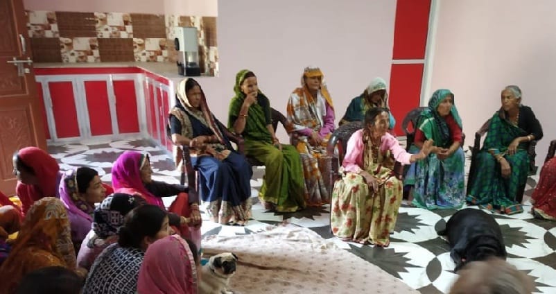 women  surrounded by legislators houses