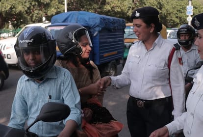 A crowd of women gathering in shops to buy helmets in chandigarh