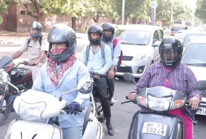 A crowd of women gathering in shops to buy helmets in chandigarh