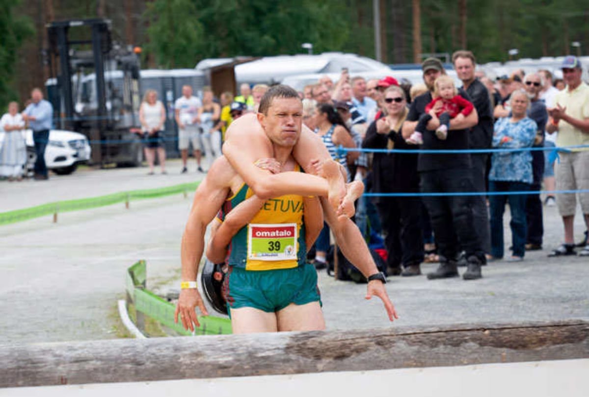 Unique competition of finland where man run one kilometer after uplift his wife on his back
