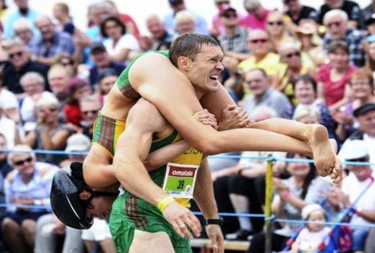 Unique competition of finland where man run one kilometer after uplift his wife on his back