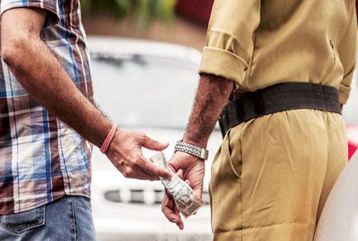 Police personnel reach ATM to take bribes from the army man